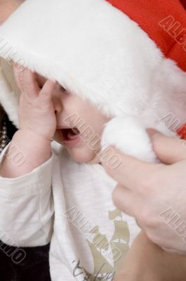 crying baby with christmas hat