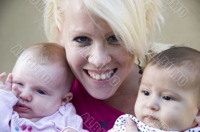 beautiful mother posing with her two kids