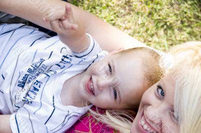 blonde young mother posing with her baby