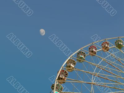 Big Ferris wheel in front of the moon