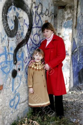 mother and daughter in ruins