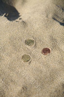 three coins at the beach