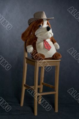 chair and toy with western hat