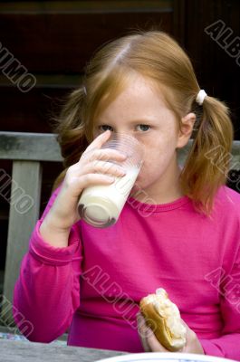 Child is drinking milk