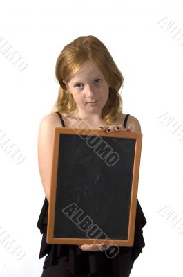 little girl is holding an empty chalkboard