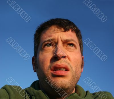 Man with a skeptical and anxious look