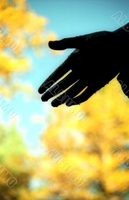 Hand on the autumn background