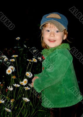 Small pretty girl on black background