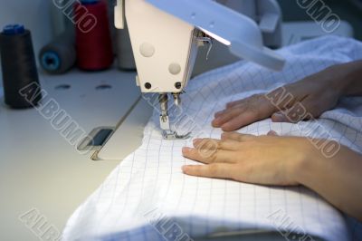 Working on a sewing machine