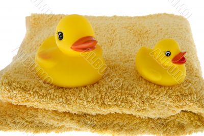 rubber duck sits on towel