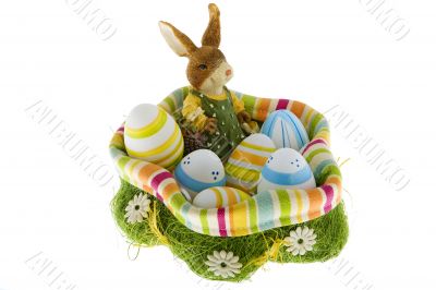 Easter bunny in the nest with eggs