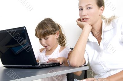 mother and daughter working on laptop