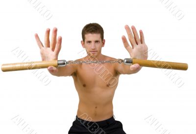 young male holding nunchaku with open palms