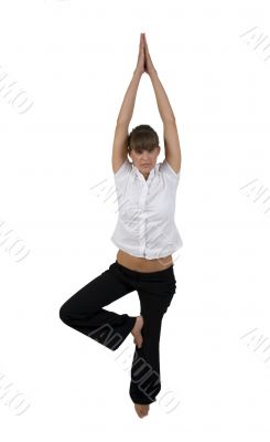 woman practicing yoga on one leg