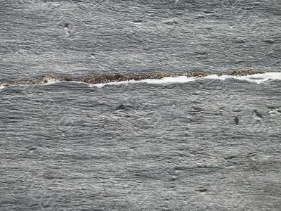 a dark grey rock close up background