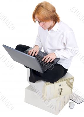 Girl working on the laptop on a white