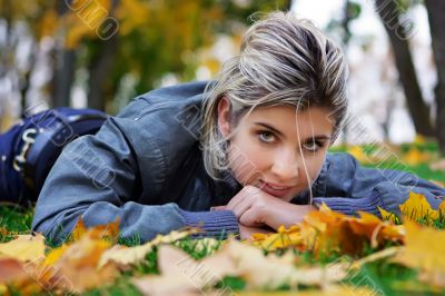 Lying on maple leaves