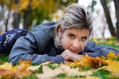 Lying on maple leaves