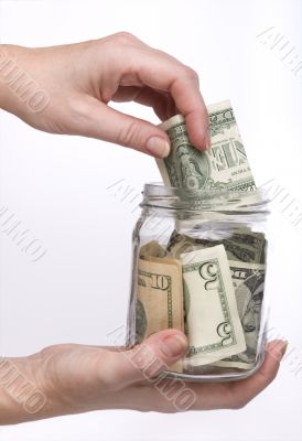 money in the glass jar
