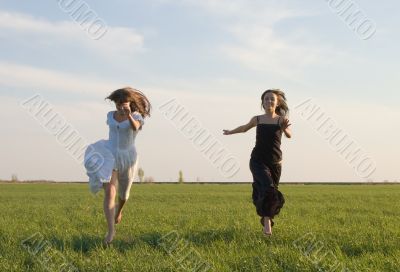 two girls running on the field 2