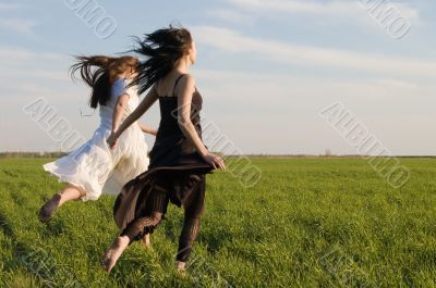 two girls running on the field 3