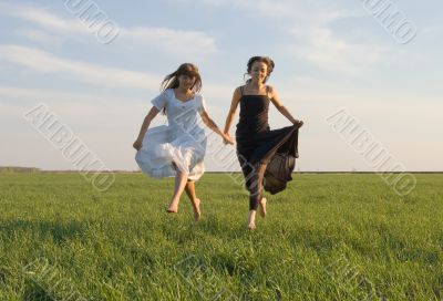 two girls running on the field 4