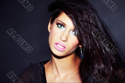 beautiful and sexy brunette girl on dark