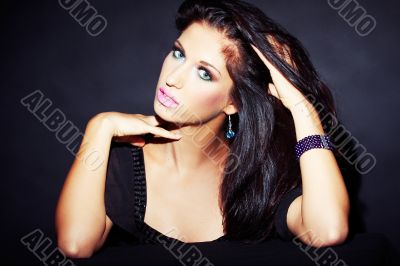 beautiful and sexy brunette girl on dark