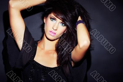 beautiful and sexy brunette girl on dark