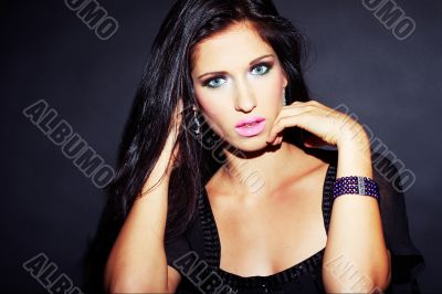 beautiful and sexy brunette girl on dark