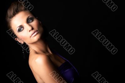 beautiful and sexy brunette fashion girl in violet dress