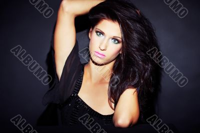beautiful and sexy brunette girl on dark