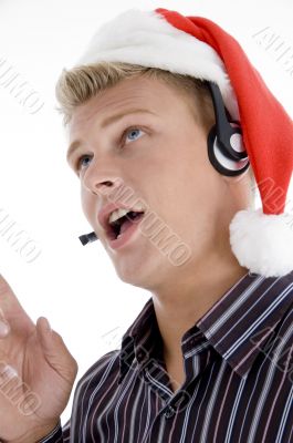 american man wearing headphone and santa hat