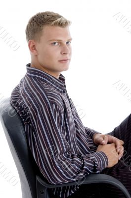 handsome businessman relaxing on chair