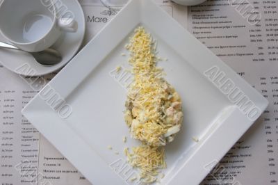 Chicken salad with egg and cup of tea