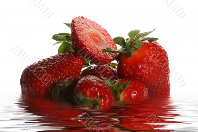 Ripe juicy strawberry in water
