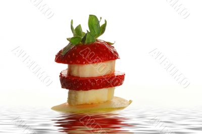 Slices of a strawberry, pear and banana