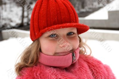 Smiling child in red hat