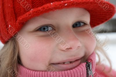 Smiling child in red hat