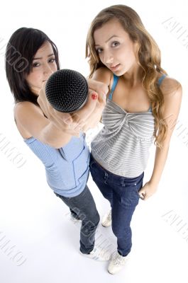 young girls showing microphone