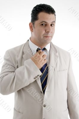 businessman adjusting his tie