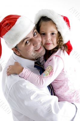 father and cute daughter with christmas hat