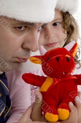 father with his daughter and teddy bear