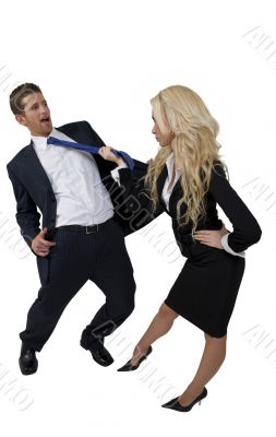 female pulling tie of man