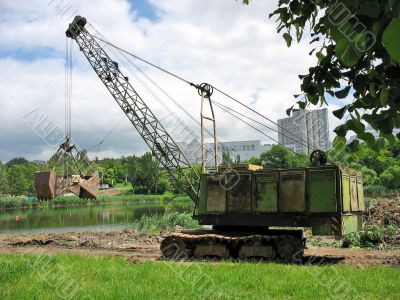 old dredge on coast of a lake