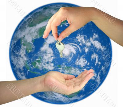 Two woman hands giving key from the earth isolated over white