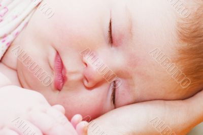 Sleep Baby on a mother hands
