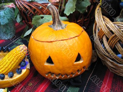 helloween vegetables pumpkin composition concept on leaves basket and a carpet background