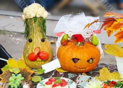 helloween vegetables pumpkin composition concept on autumn leaves and a carpet background