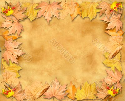 Autumn leaves yellow frame over old paper background parchment w